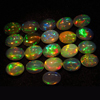 calebrated size 5x7 mm oval - Ethiopian Opal - really - tope grade high quality CABOCHON - oval shape - each pcs - have amazing - beautifull - flashy fire all around in the stone -21 pcs - approx -- STUNNING QUALITY - VERY VERY RARE